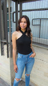 MODEL IN A CRISS CROSS TOP WITH JEANS